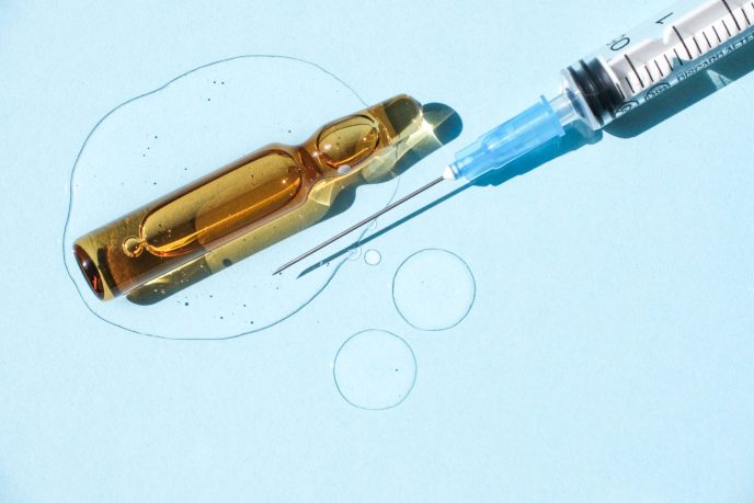 ampoule-injection-syringe-and-a-drop-of-cosmetic-2026-01-06-00-48-24-utc (1)